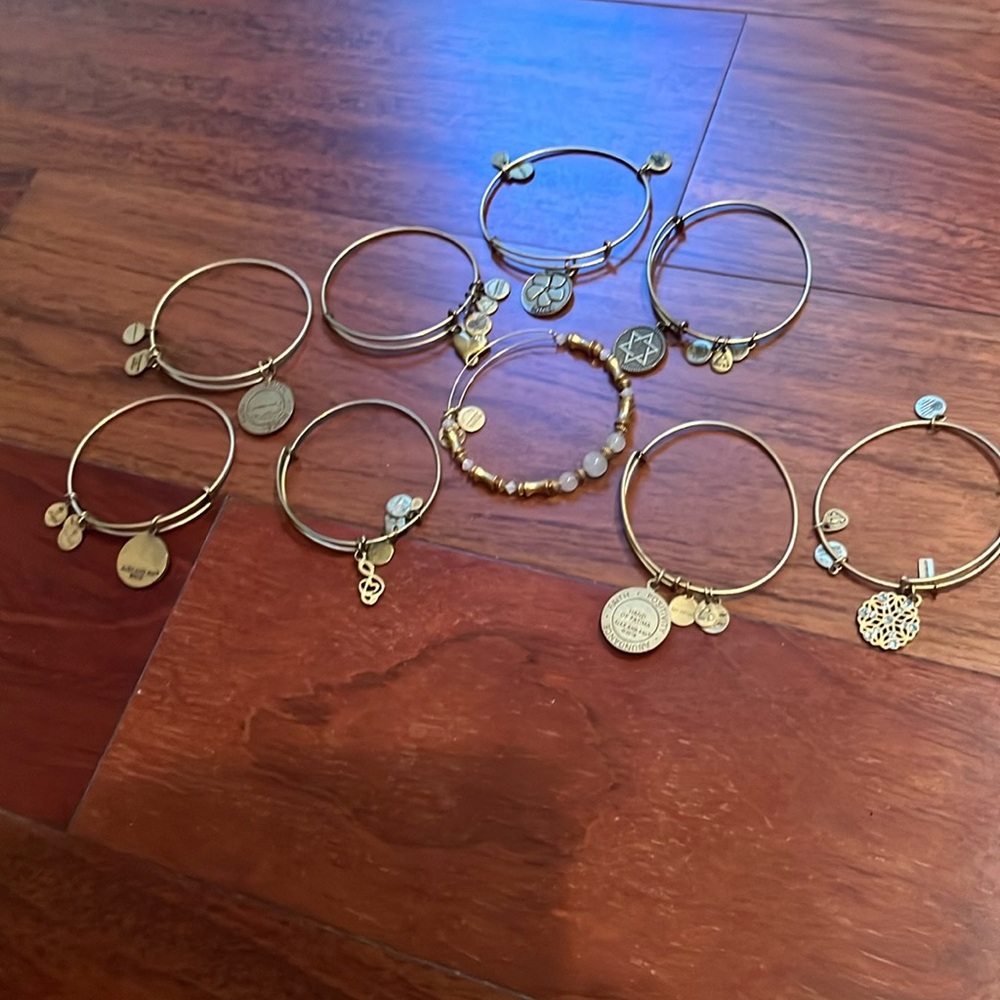 9 gold color Alex and ani bracelets